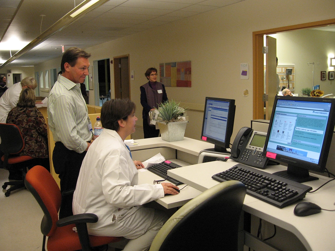 Administrative staff looking at computer screen monitor